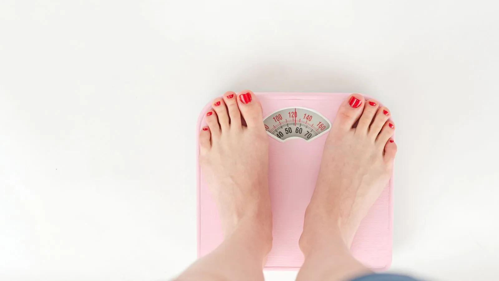 A woman's feet on a weighing scale